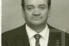 Homem com caneta no bolso do paletó